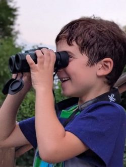 Dude looking through binoculars